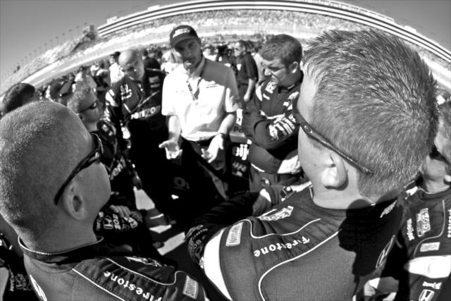 Tim Cindric chats with his team before the race begins -- Photo by: Shawn Gritzmacher