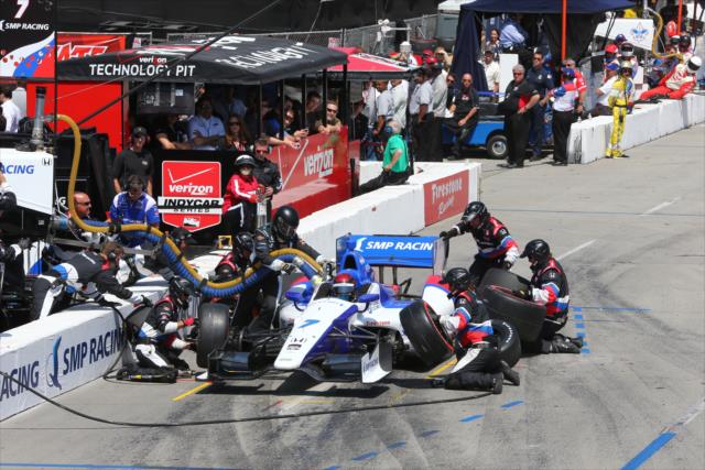The crew of Mikhail Aleshin go to work in the pits -- Photo by: Chris Jones