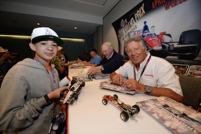 Mario Andretti poses for a photo during the autograph session at Long Beach -- Photo by: John Cote