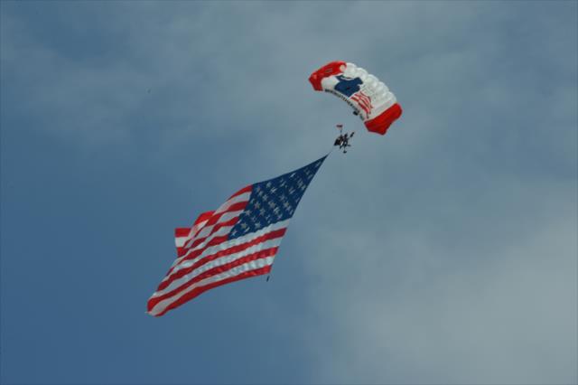 The American flag makes a grand entrance before the start of the Toyota Grand Prix of Long Beach -- Photo by: John Cote
