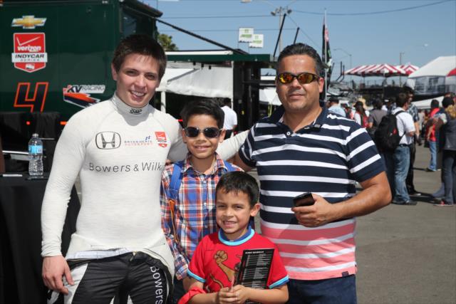 Gabby Chaves meets a few fans during the autograph session in the Long Beach paddock -- Photo by: Chris Jones