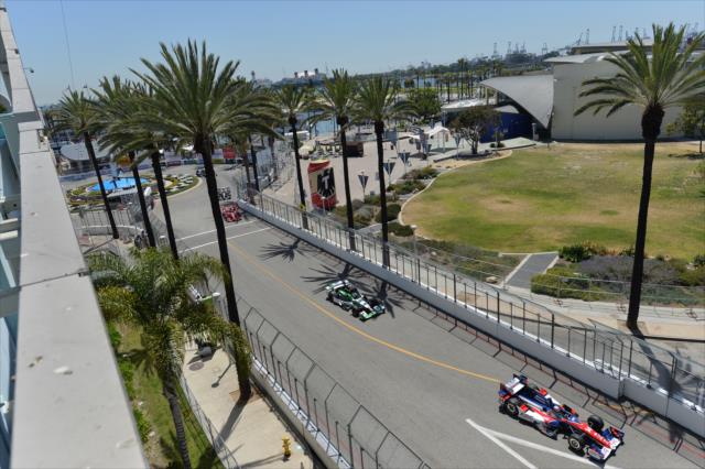 Takuma Sato leads a group of cars toward Turn 5 during practice for the Toyota Grand Prix of Long Beach -- Photo by: Chris Owens