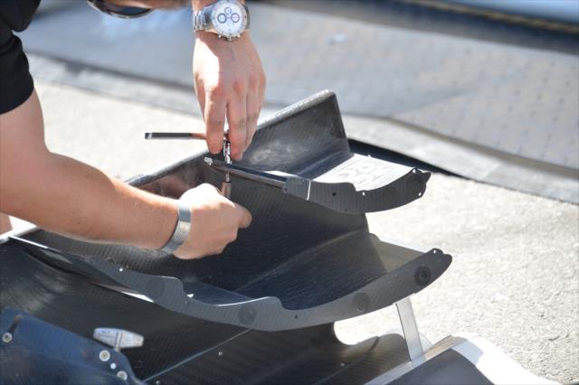 Steady hands work on a Honda front wing prior to practice for the Toyota Grand Prix of Long Beach -- Photo by: Chris Owens