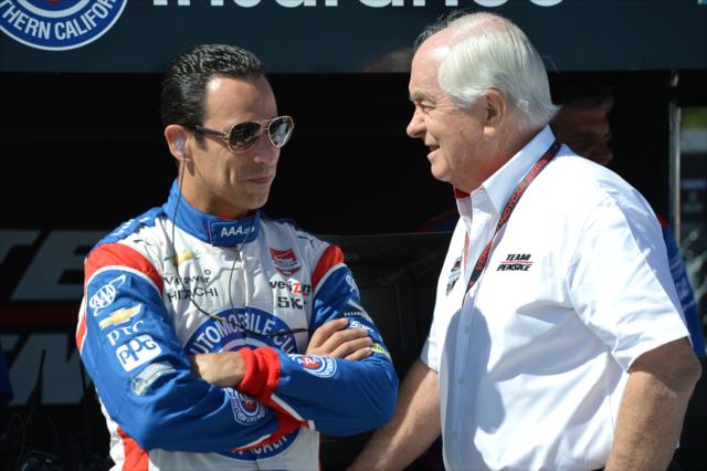 Helio Castroneves and team owner Roger Penske chat on pit lane prior to practice for the Toyota Grand Prix of Long Beach -- Photo by: Chris Owens