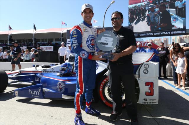 Helio Castroneves receives the Verizon P1 Award for winning the pole for the Toyota Grand Prix of Long Beach -- Photo by: Chris Jones