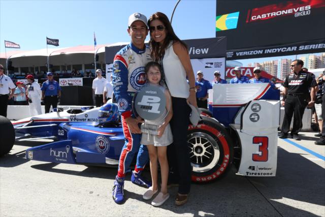 Helio Castroneves celebrates with his family for winning the pole position for the Toyota Grand Prix of Long Beach -- Photo by: Chris Jones