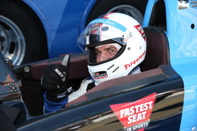 Tony Dovolani from Dancing With the Stars strapped in and ready for his two-seater ride with Mario Andretti on the Streets of Long Beach -- Photo by: Chris Jones