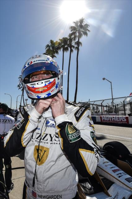 Josef Newgarden straps on his helmet prior to qualifications for the Toyota Grand Prix of Long Beach -- Photo by: Chris Owens