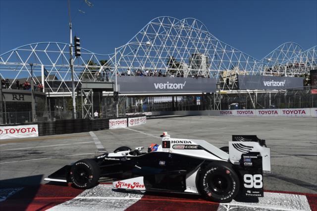 Alexander Rossi dives into Turn 1 during practice for the Toyota Grand Prix of Long Beach -- Photo by: Chris Owens