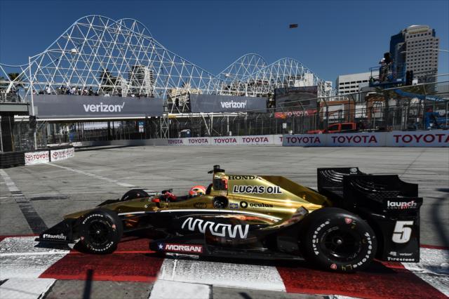 James Hinchcliffe dives into Turn 1 during practice for the Toyota Grand Prix of Long Beach -- Photo by: Chris Owens