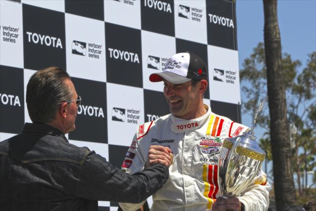 Max Papis is congratuated by actor Robert Patrick following the Toyota Celebrity Pro-Am race on the Streets of Long Beach -- Photo by: Richard Dowdy