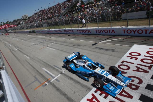 Simon Pagenaud flashes across the start-finish line during the Toyota Grand Prix of Long Beach -- Photo by: Chris Jones