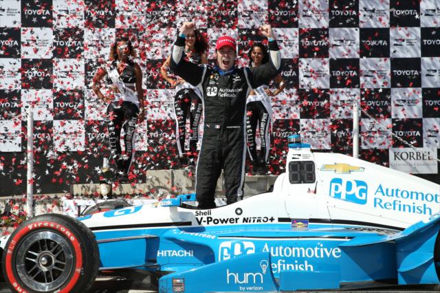 The confetti flies in Victory Circle as Simon Pagenaud celebrates his win in the Toyota Grand Prix of Long Beach -- Photo by: Chris Jones