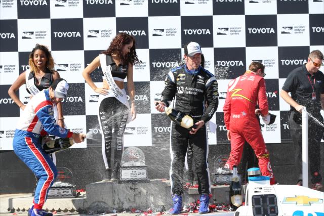 The champagne flies in Victory Circle following the Toyota Grand Prix of Long Beach -- Photo by: Chris Jones