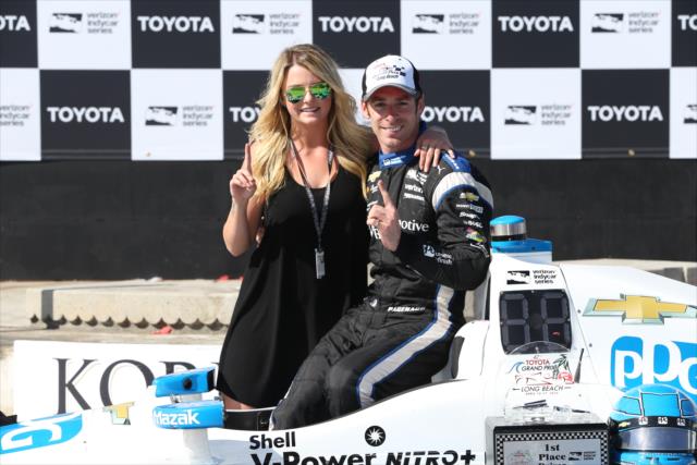 Simon Pagenaud and his girlfriend, Hailie, celebrate in Victory Lane following his win in the Toyota Grand Prix of Long Beach -- Photo by: Chris Jones