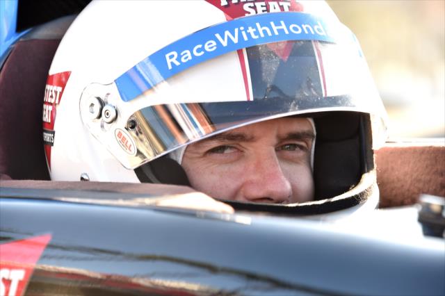 Topher Grace is strapped into the two-seater for his ride around the Streets of Long Beach with Mario Andretti -- Photo by: Chris Owens