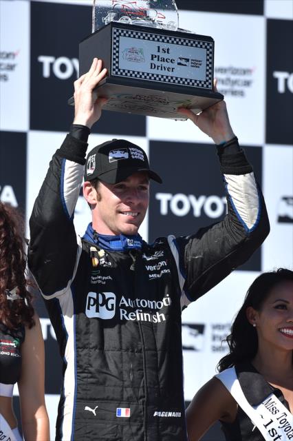 Simon Pagenaud hoists his trophy following his win in the 2016 Toyota Grand Prix of Long Beach -- Photo by: Chris Owens