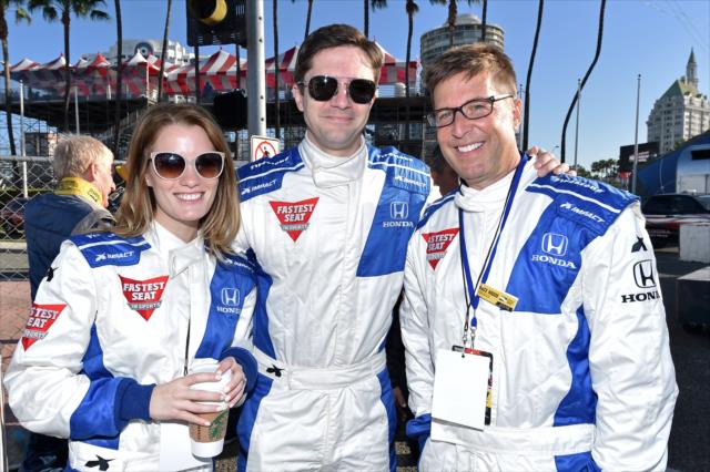 Topher Grace, Ashley Hinshaw, and Spike Feresten are ready for their two-seater ride prior to the Toyota Grand Prix of Long Beach -- Photo by: Chris Owens