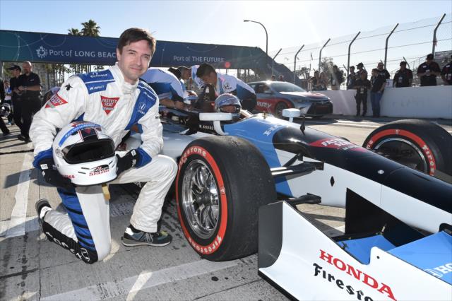Actor Topher Grace poses with the two-seater following his ride on the Streets of Long Beach -- Photo by: Chris Owens