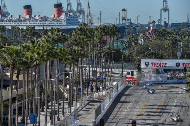 The field streams out of Turn 5 during the Toyota Grand Prix of Long Beach -- Photo by: Chris Owens