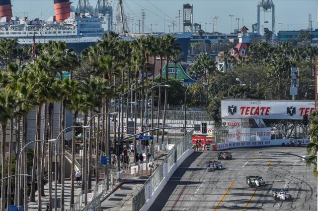 The field streams out of Turn 5 during the Toyota Grand Prix of Long Beach -- Photo by: Chris Owens