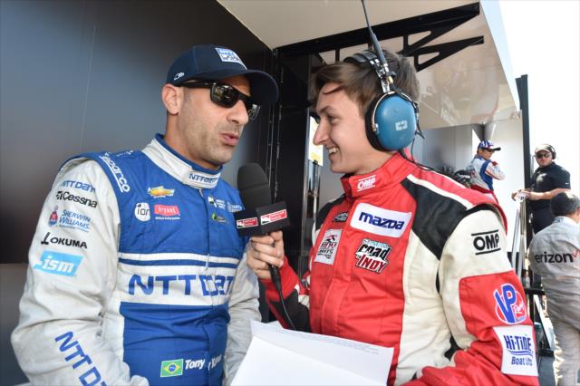 Tony Kanaan is interviewed by INDYCAR Radio's Zach Veach during pre-race festivities for the Toyota Grand Prix of Long Beach -- Photo by: Chris Owens