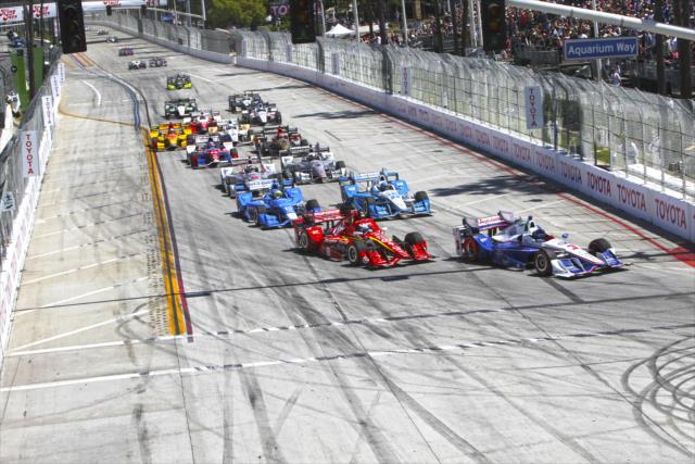 Helio Castroneves and Scott Dixon lead the field into Turn 1 at the start of the Toyota Grand Prix of Long Beach -- Photo by: Richard Dowdy