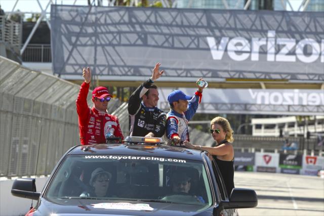 The podium of Simon Pagenaud, Scott Dixon, and Helio Castroneves waive to the crowd following the Toyota Grand Prix of Long Beach -- Photo by: Richard Dowdy