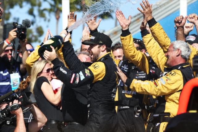 James Hinchcliffe sprays his team in Victory Lane after winning the Toyota Grand Prix of Long Beach -- Photo by: Chris Jones