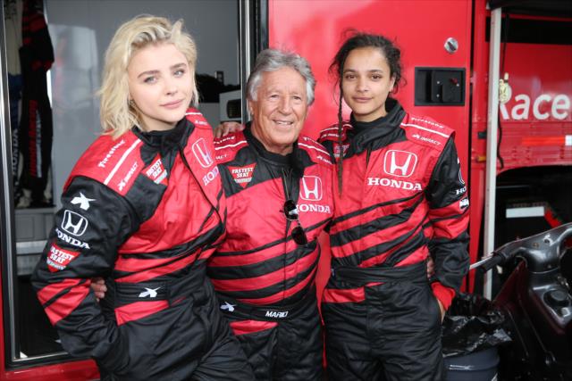 Actresses ChloÃ« Grace Moretz and Sasha Lane with Mario Andretti prior to their two-seater rides at Long Beach -- Photo by: Chris Jones