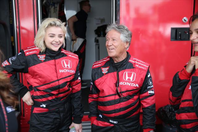Actresses ChloÃ« Grace Moretz with Mario Andretti prior to her two-seater rides at Long Beach -- Photo by: Chris Jones
