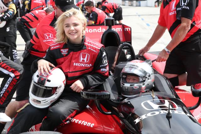 Actress ChloÃ« Grace Moretz with Mario Andretti following her two-seater ride at Long Beach -- Photo by: Chris Jones