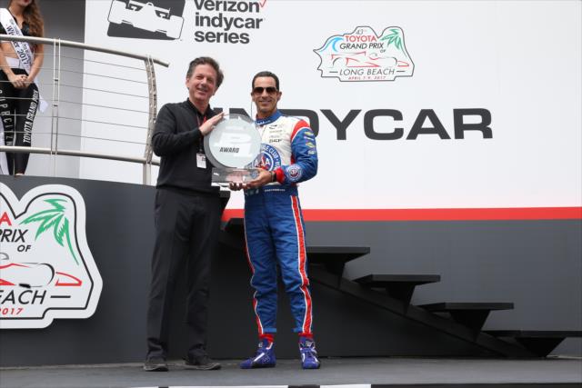 Helio Castroneves accepts the Verizon P1 Award for winning the pole position during pre-race festivities for the Toyota Grand Prix of Long Beach -- Photo by: Chris Jones