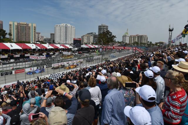 Scott Dixon leads the field down the frontstretch to start the Toyota Grand Prix of Long Beach -- Photo by: Christopher Owens