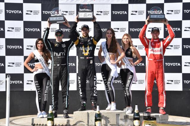 James Hinchcliffe, Sebastien Bourdais, and Josef Newgarden hoist their trophies in Victory Circle following the Toyota Grand Prix of Long Beach -- Photo by: Christopher Owens