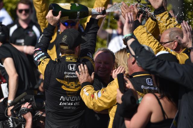James Hinchcliffe sprays his crew in Victory Lane following his win in the Toyota Grand Prix of Long Beach -- Photo by: Christopher Owens