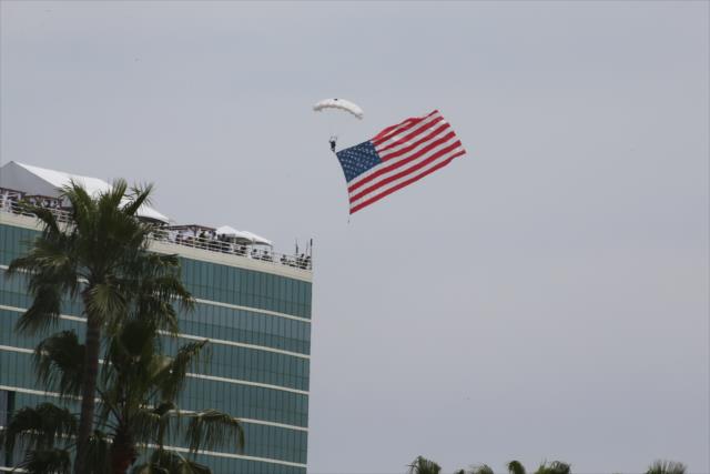 The US Flag comes in for approach during pre-race festivities for the Toyota Grand Prix of Long Beach -- Photo by: Richard Dowdy