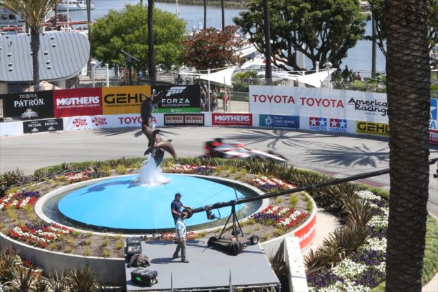 Sebastien Bourdais flashes by the fountain turn during the Toyota Grand Prix of Long Beach -- Photo by: Richard Dowdy
