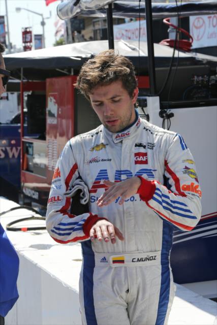 Carlos Munoz chats with his team following the Toyota Grand Prix of Long Beach -- Photo by: Richard Dowdy