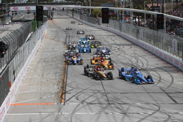 Scott Dixon and James Hinchcliffe lead the field into Turn 1 during the start of the Toyota Grand Prix of Long Beach -- Photo by: Richard Dowdy