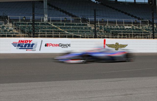 Stefan Wilson in-blur entering Turn 1 during the final practice for the 102nd Indianapolis 500 on Miller Lite Carb Day at the Indianapolis Motor Speedway -- Photo by: Richard Dowdy
