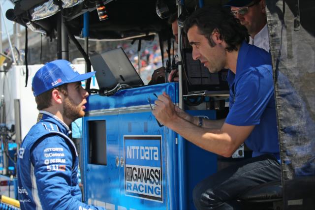 Ed Jones chats with Dario Franchitti along pit lane prior to the final practice on Miller Lite Carb Day at the Indianapolis Motor Speedway -- Photo by: Richard Dowdy