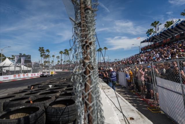 Fans and photographers watch as Josef Newgarden flies by. -- Photo by: Stephen King