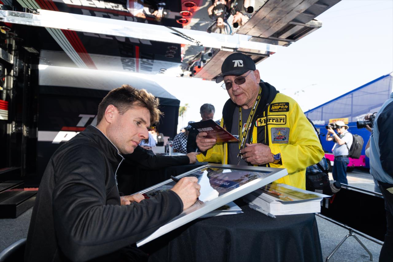 Will Power signs for a fan - Acura Grand Prix of Long Beach - By: Travis Hinkle -- Photo by: Travis Hinkle