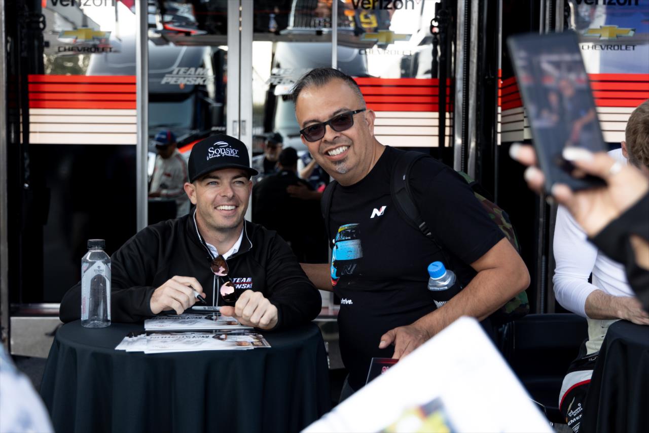 Scott McLaughlin takes a photo with a fan - Acura Grand Prix of Long Beach - By: Travis Hinkle -- Photo by: Travis Hinkle