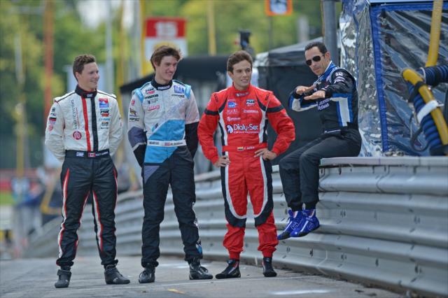 (L to R): Scott Hargrove, Matthew Brabham, and Carlos Munoz chat with Helio Castroneves at Mid-Ohio -- Photo by: John Cote
