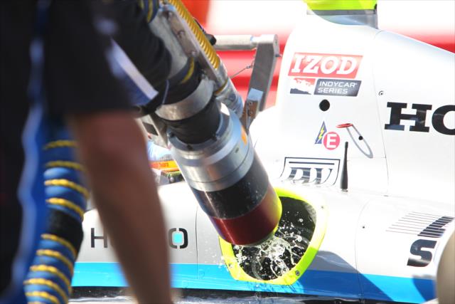 Fuel sprays out of the buckeye on Josef Newgarden's car -- Photo by: Chris Jones