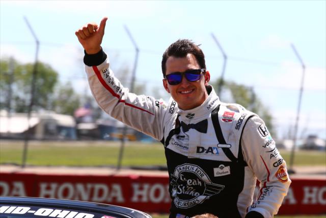 Graham Rahal waives to the crowd during his pre-race parade lap prior to the Honda Indy 200 at Mid-Ohio -- Photo by: Bret Kelley