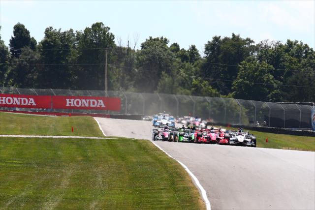 Scott Dixon leads the field down the backstretch to the green flag to start the Honda Indy 200 at Mid-Ohio -- Photo by: Bret Kelley