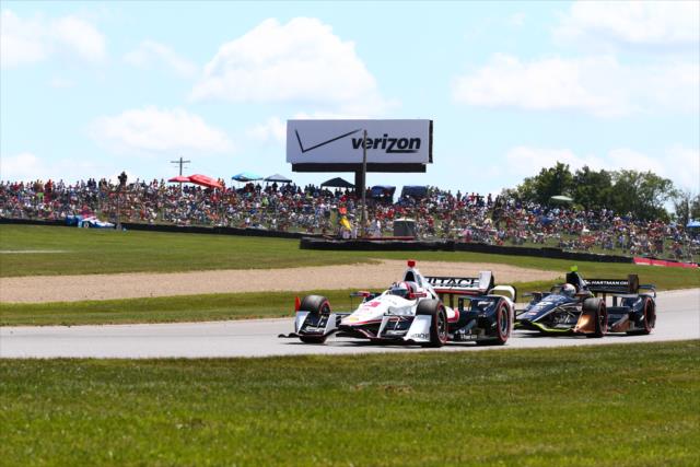 Helio Castroneves and Josef Newgarden go nose-to-tail down the backstretch during the Honda Indy 200 at Mid-Ohio -- Photo by: Bret Kelley
